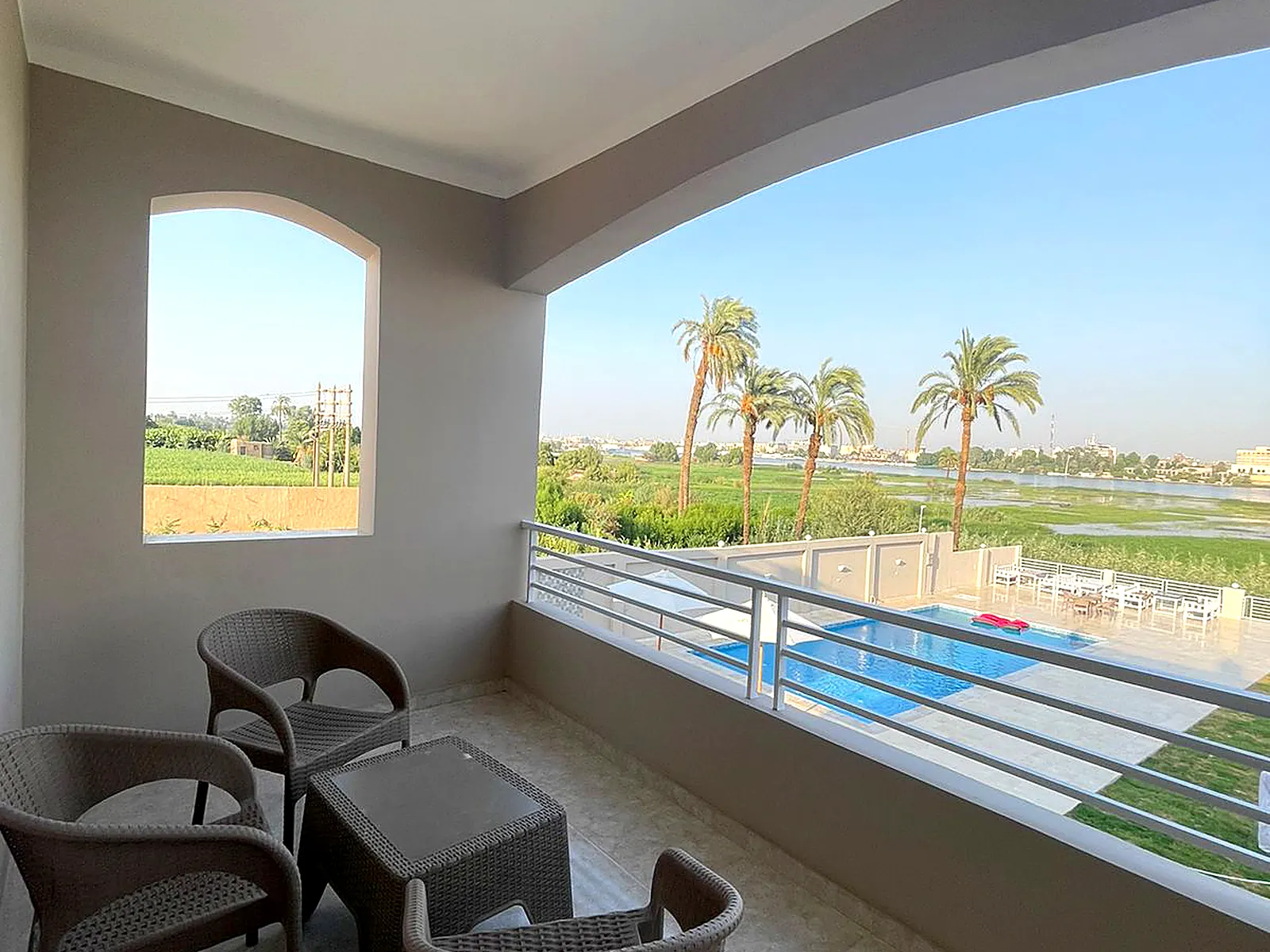 Private balcony overlooking the Nile and pool at Luxury Nile View 2